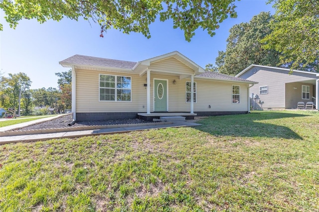 ranch-style home featuring a front yard