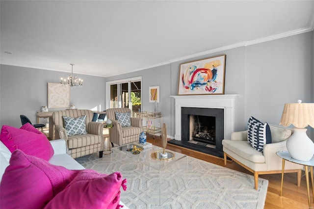 living room featuring ornamental molding, a chandelier, and hardwood / wood-style floors