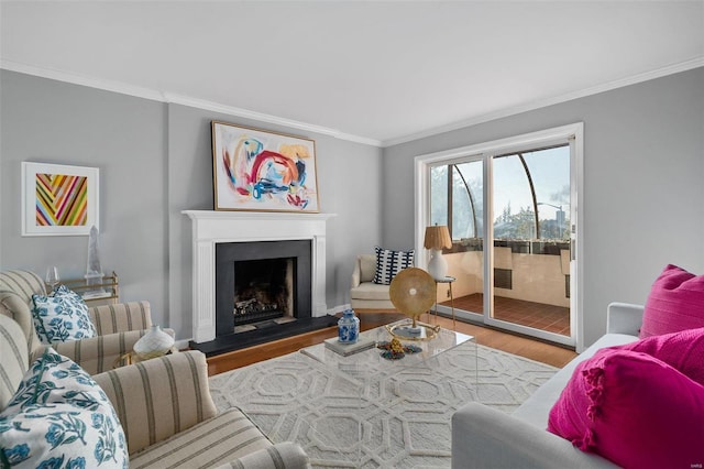 living room with light wood-type flooring and ornamental molding