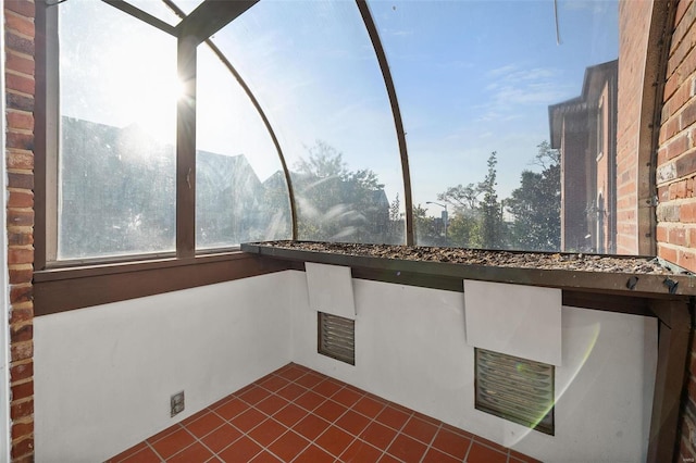 unfurnished sunroom with a mountain view