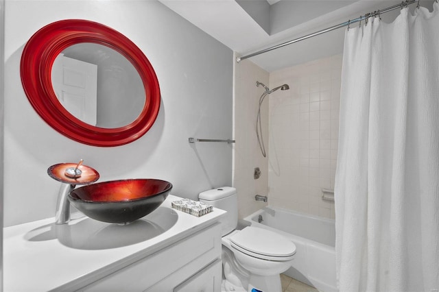 full bathroom featuring vanity, shower / tub combo with curtain, and toilet