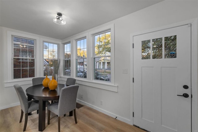 dining area with light hardwood / wood-style floors