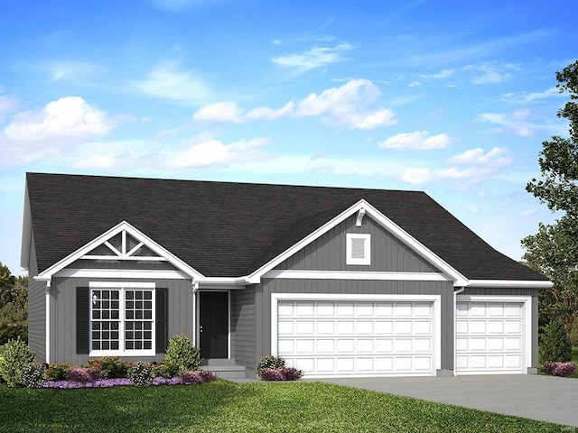 view of front facade with a front yard and a garage