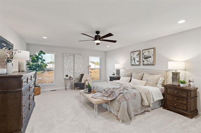 bedroom with ceiling fan and light colored carpet