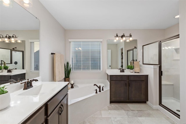 bathroom with independent shower and bath and vanity