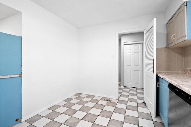 kitchen featuring stainless steel dishwasher and gray cabinets