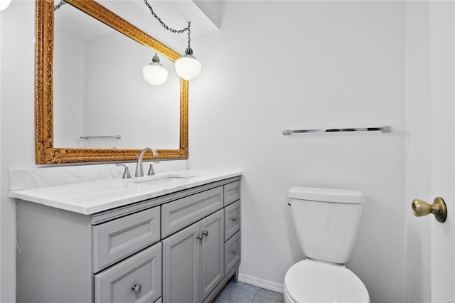 bathroom featuring vanity, toilet, and tile patterned flooring