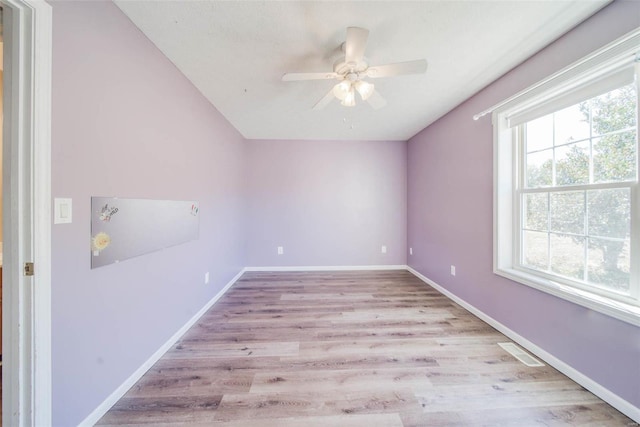 unfurnished room with light hardwood / wood-style floors and ceiling fan