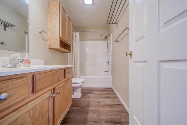 full bathroom with vanity, toilet, wood-type flooring, and shower / bath combo with shower curtain