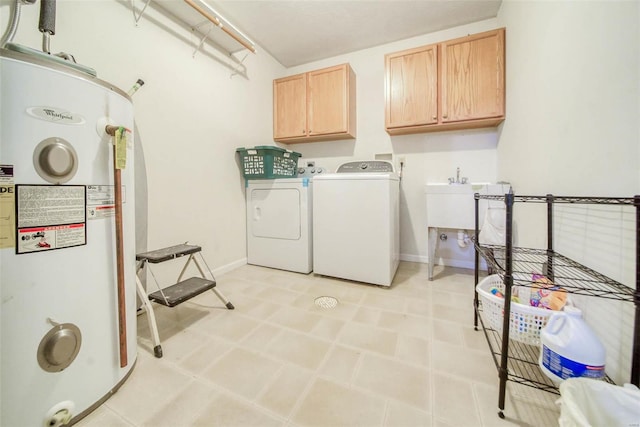 laundry room with cabinets, electric water heater, sink, and washer and clothes dryer