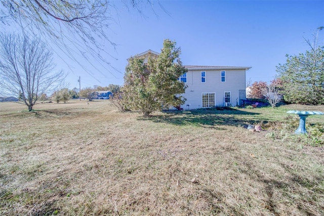 rear view of house with a lawn