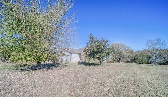 view of yard with a garage