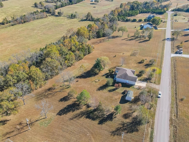 birds eye view of property with a rural view