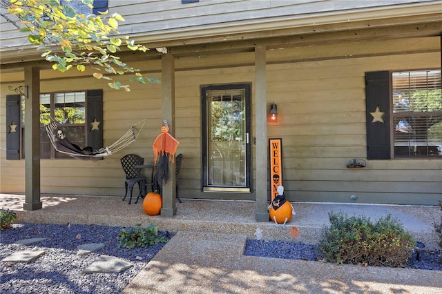 doorway to property with a porch