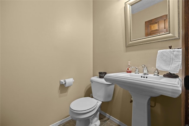 bathroom with tile patterned flooring and toilet