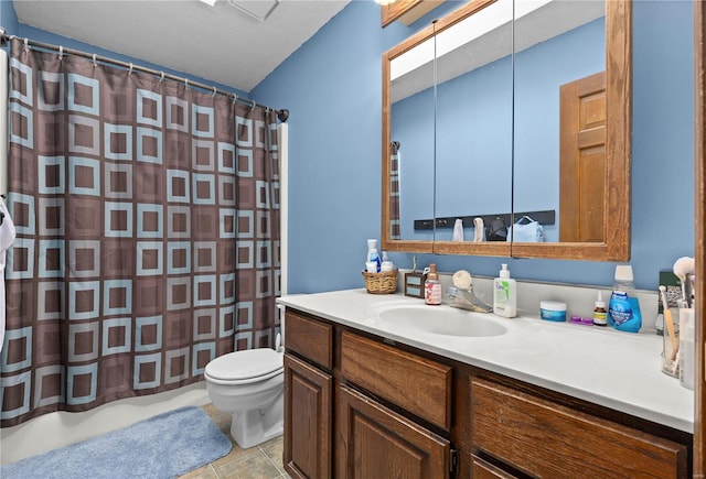 bathroom with tile patterned flooring, toilet, a textured ceiling, vanity, and a shower with curtain