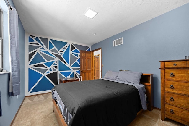 carpeted bedroom featuring a textured ceiling