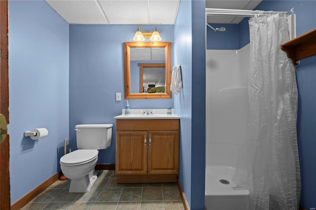 bathroom featuring vanity, toilet, and a shower with shower curtain