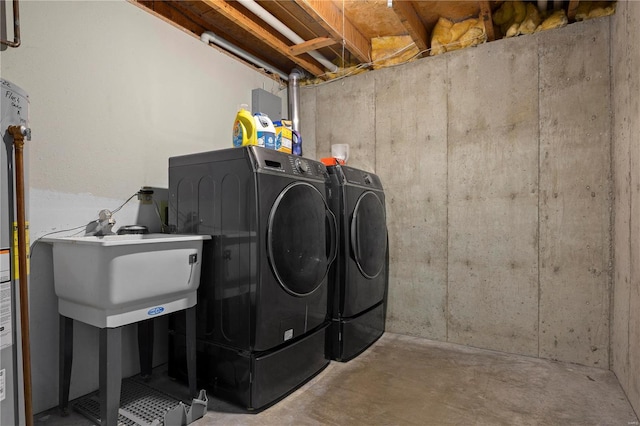 washroom featuring independent washer and dryer and sink