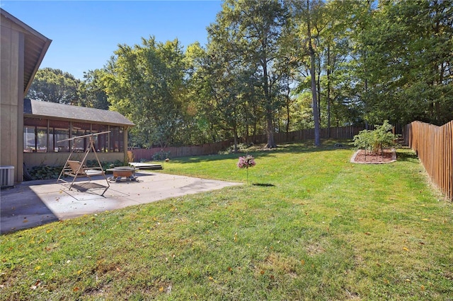 view of yard with cooling unit and a patio area