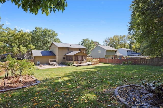 view of yard featuring a deck and a patio area