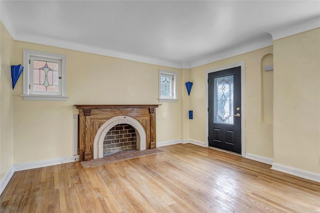 unfurnished living room with wood-type flooring