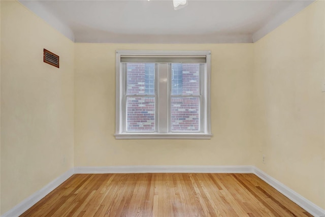 unfurnished room with light hardwood / wood-style floors