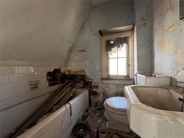 bathroom with a bathtub and toilet