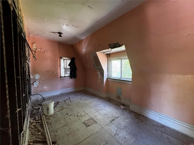 bonus room featuring lofted ceiling