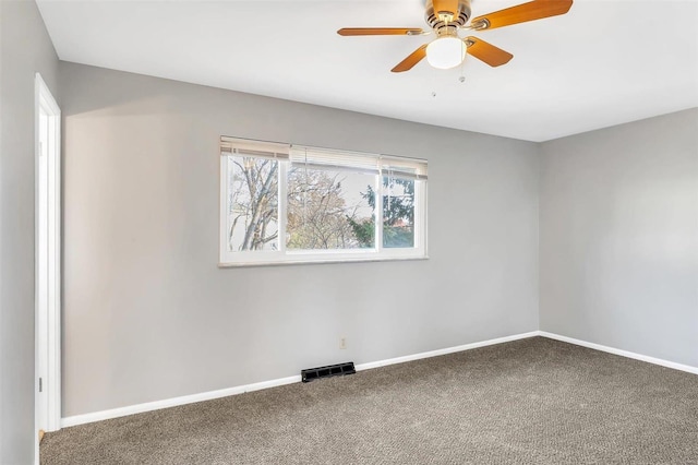 empty room featuring carpet and ceiling fan