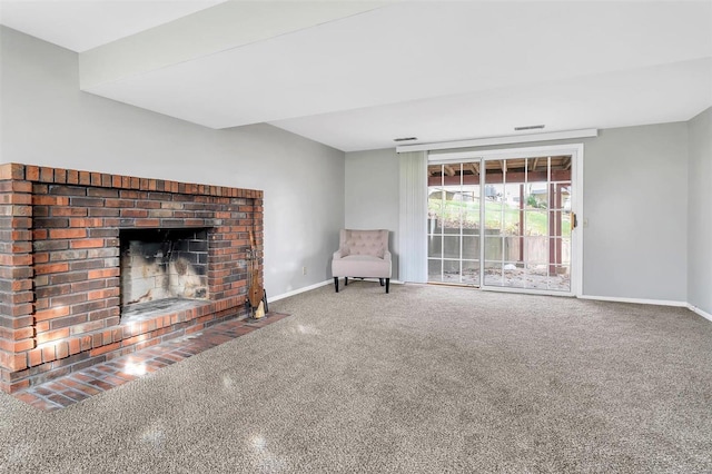 unfurnished living room with carpet and a brick fireplace