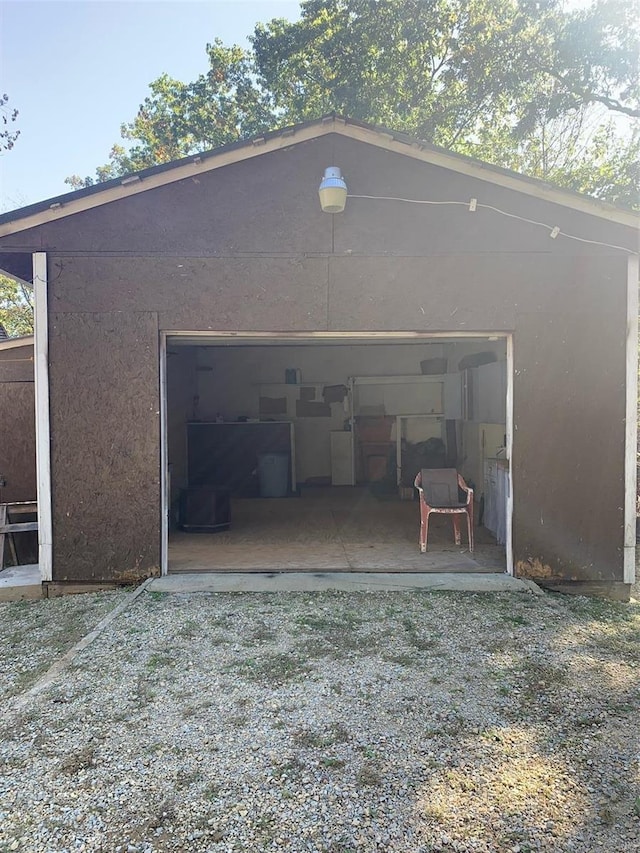 view of outbuilding featuring a garage and driveway