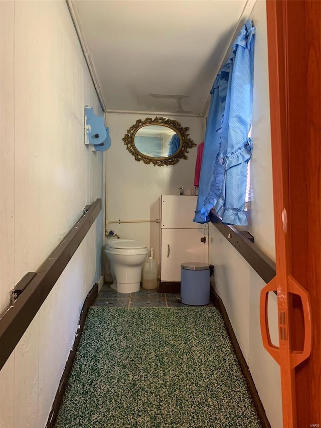 half bathroom with vanity and toilet
