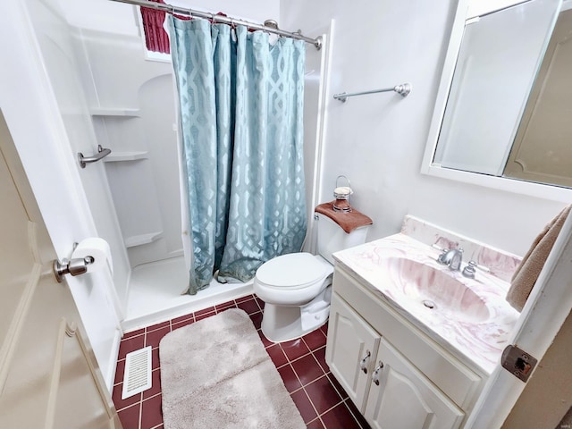 bathroom with tile patterned flooring, vanity, toilet, and a shower with shower curtain