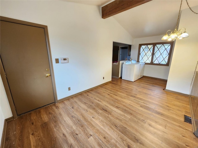 interior space with a chandelier, light wood-type flooring, lofted ceiling with beams, and washer and clothes dryer