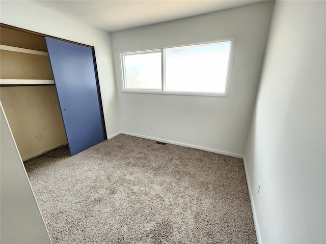 unfurnished bedroom featuring carpet flooring