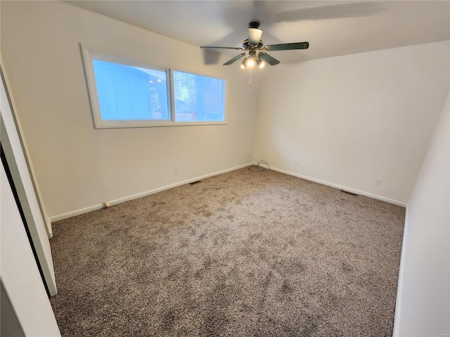 carpeted empty room with ceiling fan