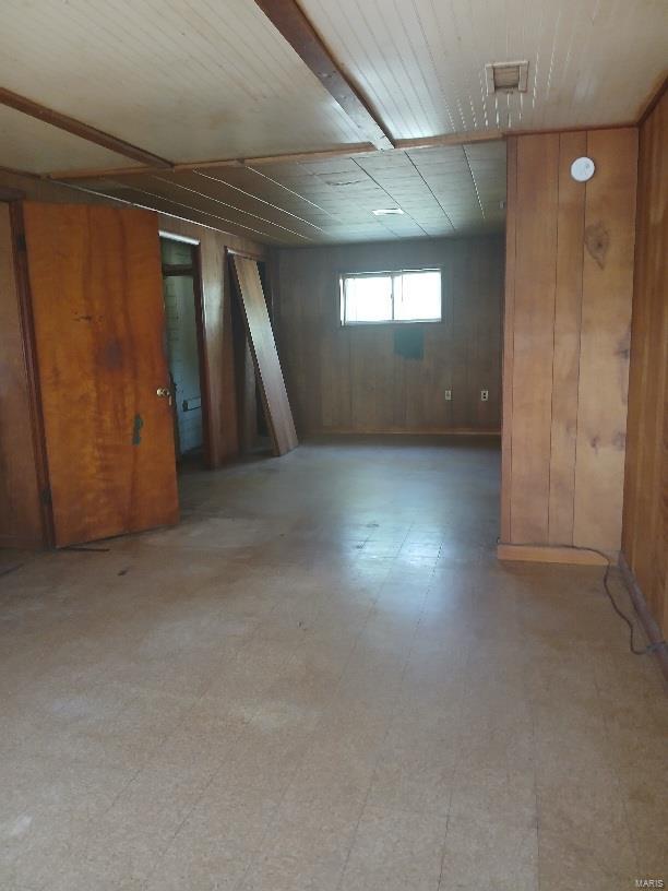 basement with wood walls