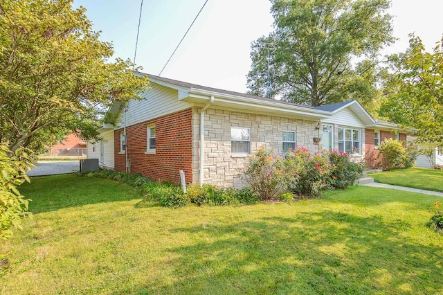 view of home's exterior featuring a lawn