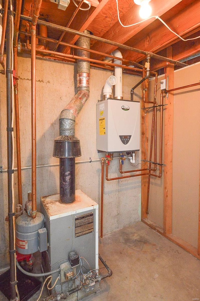 utility room featuring water heater