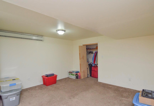 basement with carpet flooring and a wall unit AC