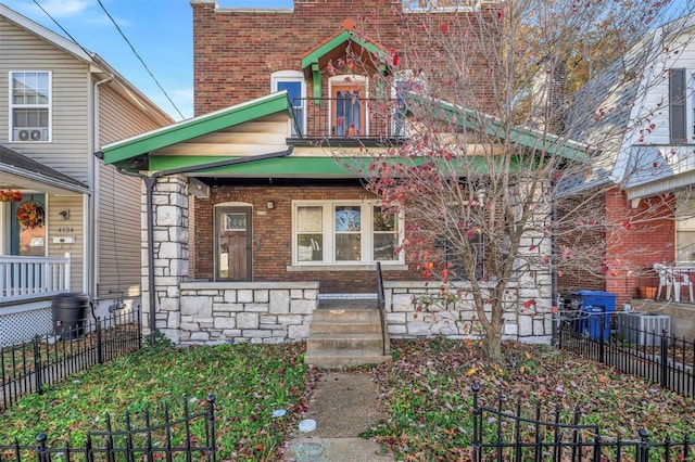 view of front of home with a balcony