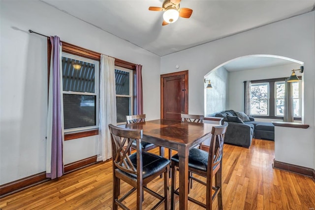 dining area featuring ceiling fan and light hardwood / wood-style flooring