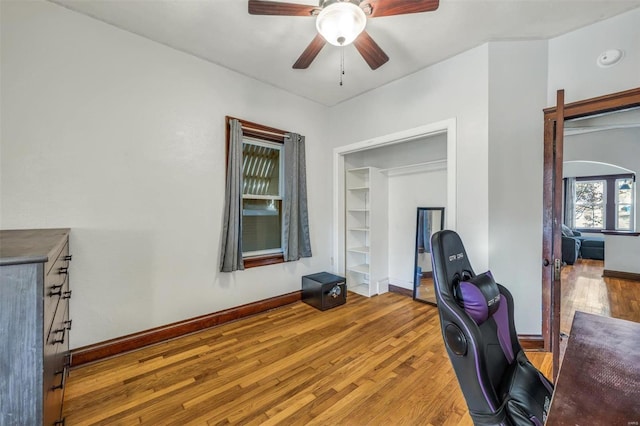 office featuring ceiling fan and light hardwood / wood-style flooring