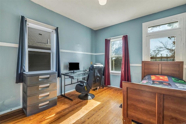 office with light wood-type flooring