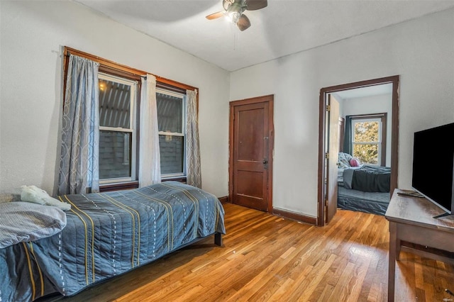 bedroom featuring ceiling fan and light hardwood / wood-style floors