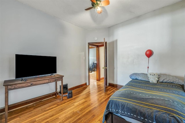 bedroom featuring ceiling fan and wood-type flooring