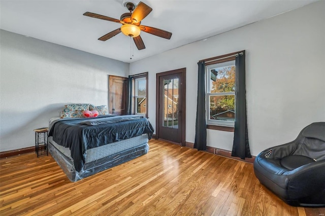 bedroom with ceiling fan and hardwood / wood-style flooring