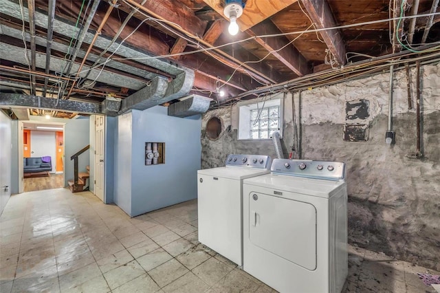 laundry area with washing machine and clothes dryer