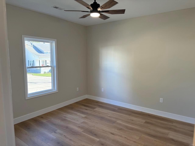 unfurnished room with light hardwood / wood-style flooring and ceiling fan